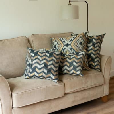 Luxe Chevron Cushion in Black and Gold