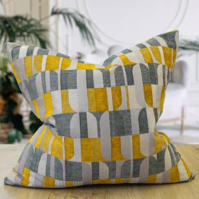 Large yellow store and grey cushions