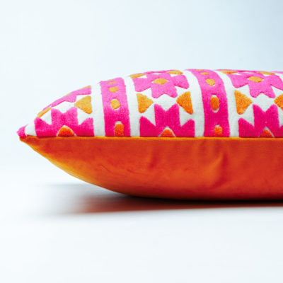 Kashan Geometric Cut Velvet Boudoir Cushion in Bright Pink & Burnt Orange